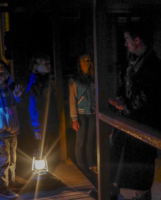children looking at tour leader during the Ghost tour Quarantine Station
