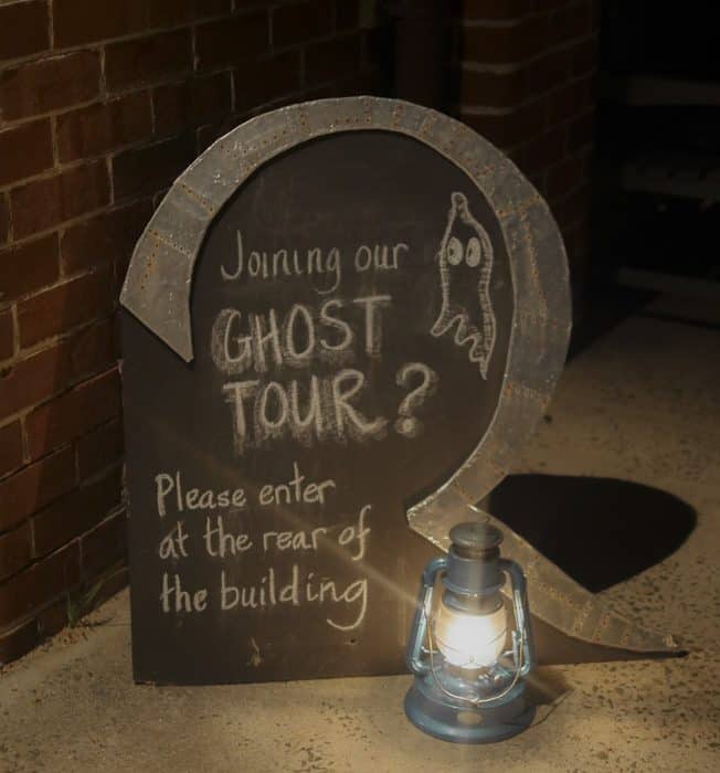 A sign for the ghost tour at the quarantine station 